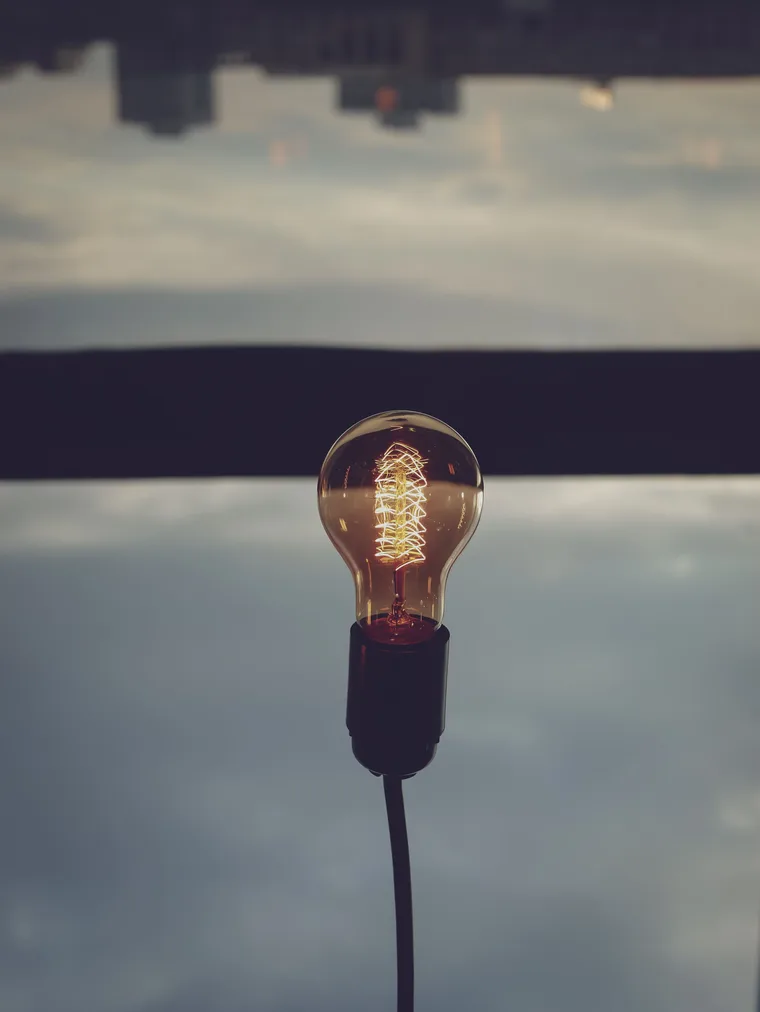 A lightbulb glowing in warm light — cognitive behavioral therapy in Los Angeles