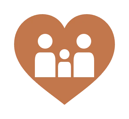 A solid heart with two parents and a child cut out of it