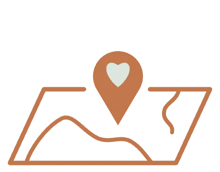 A map in perspective with a pin marking a heart