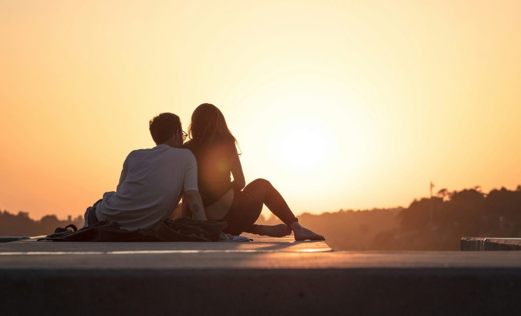 Couple reconnecting on a bench, representing the most effective couples therapy approaches for rebuilding trust and emotional connection