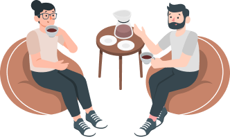 Man and woman chatting over coffee in cozy chairs